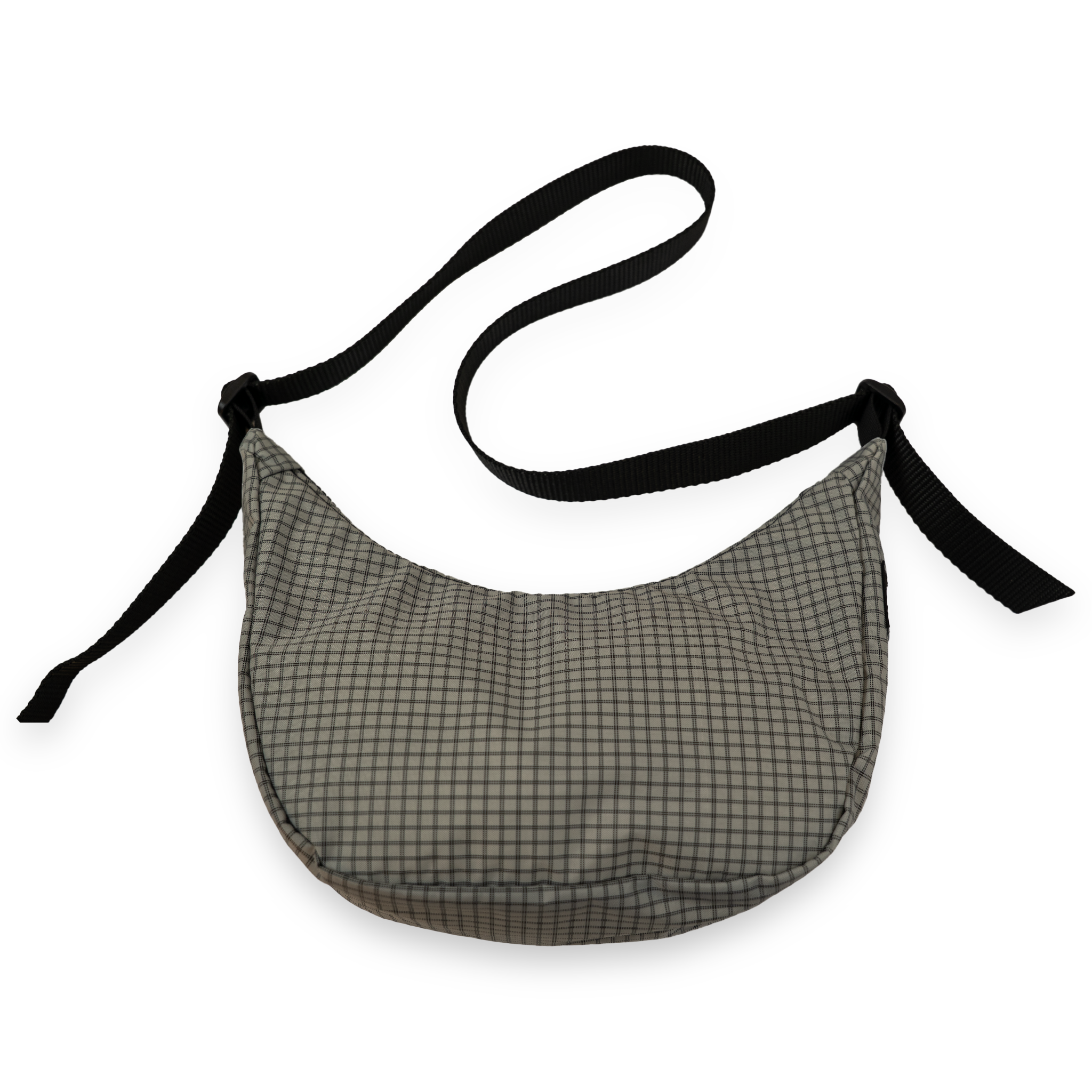 Grey crossbody bag with black strap on a white background